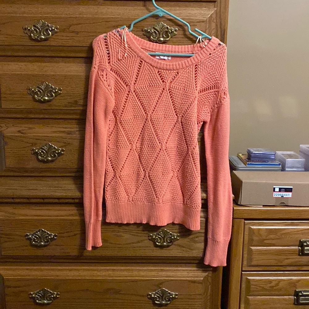 Woman’s sweater pattern in front.